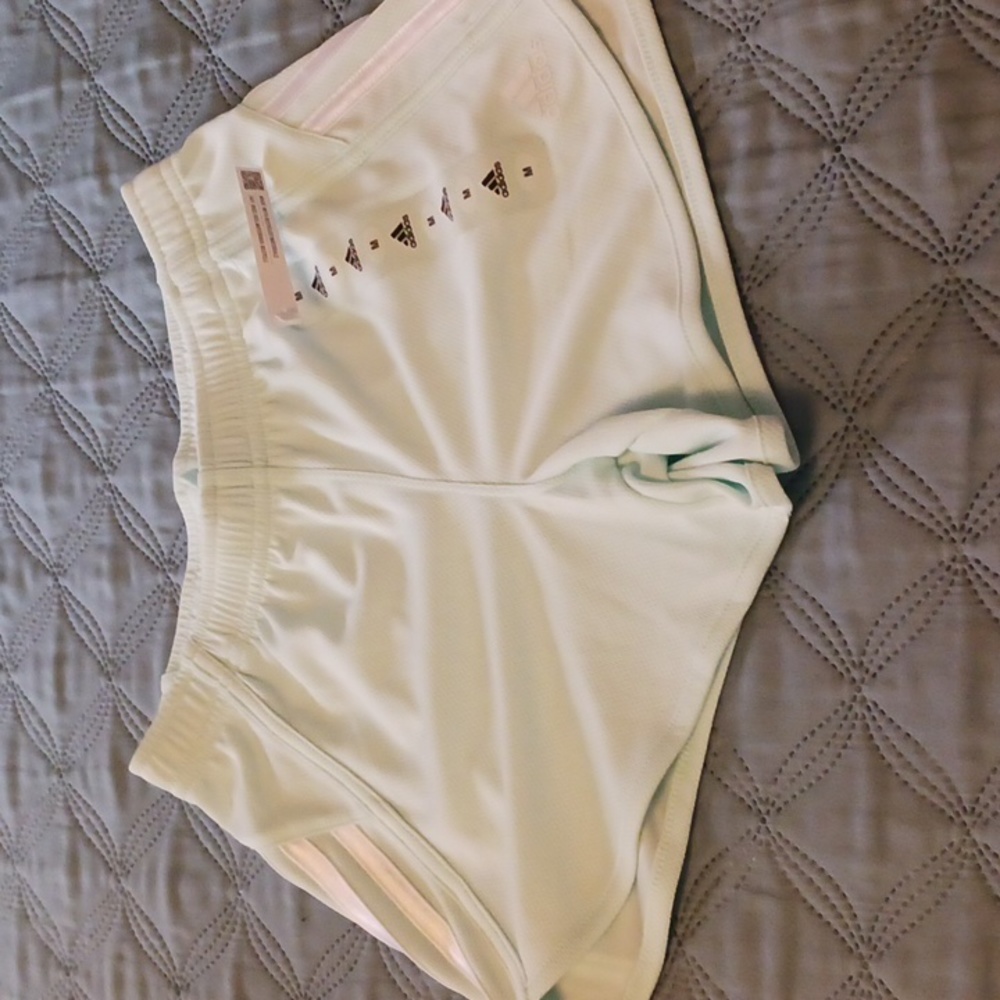 Adidas girl's shorts in mint green, size M.